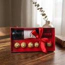 Caixa com bombons e vinho